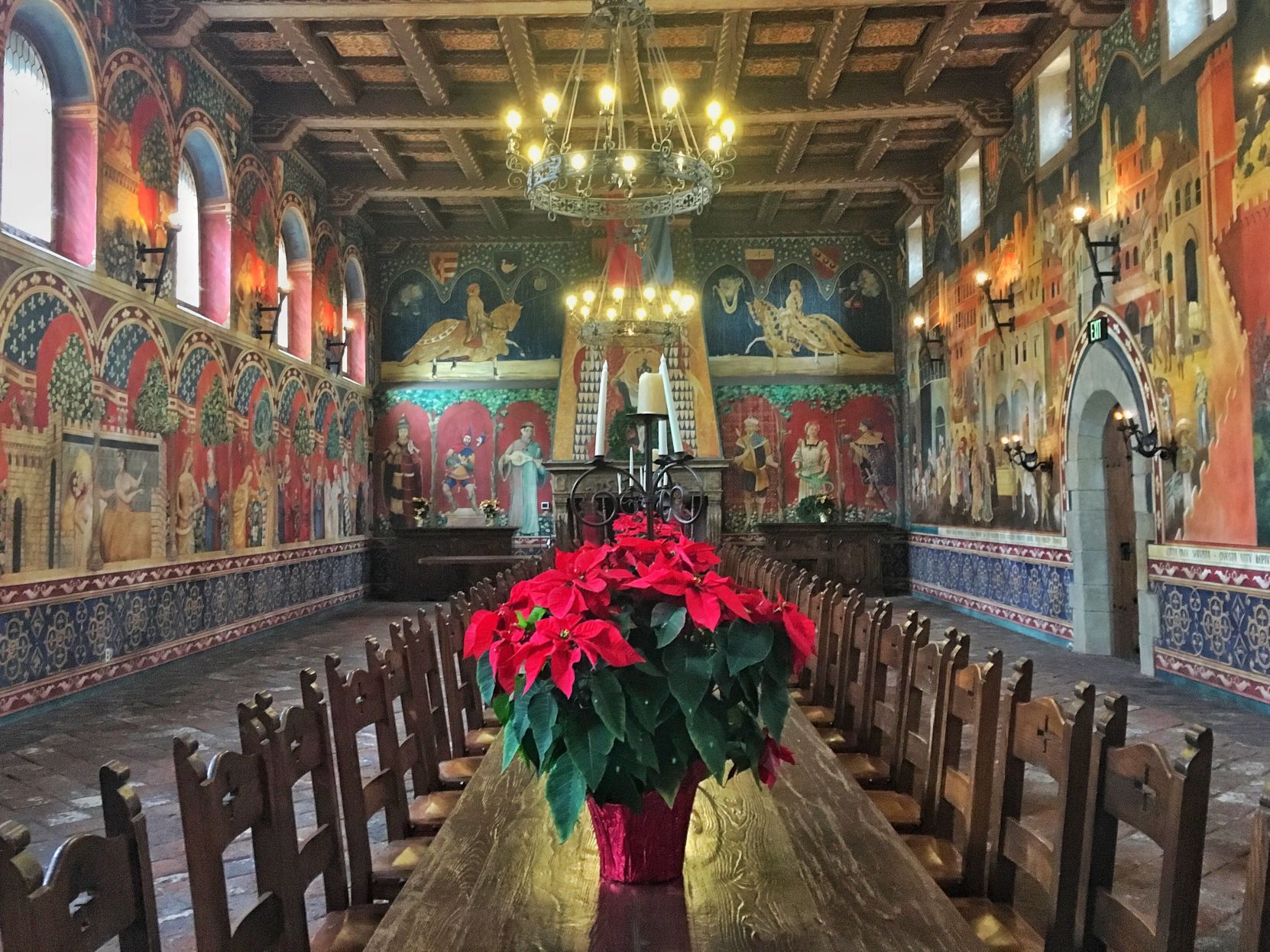 Poinsettias line the Great Hall in Castello di Amorosa
